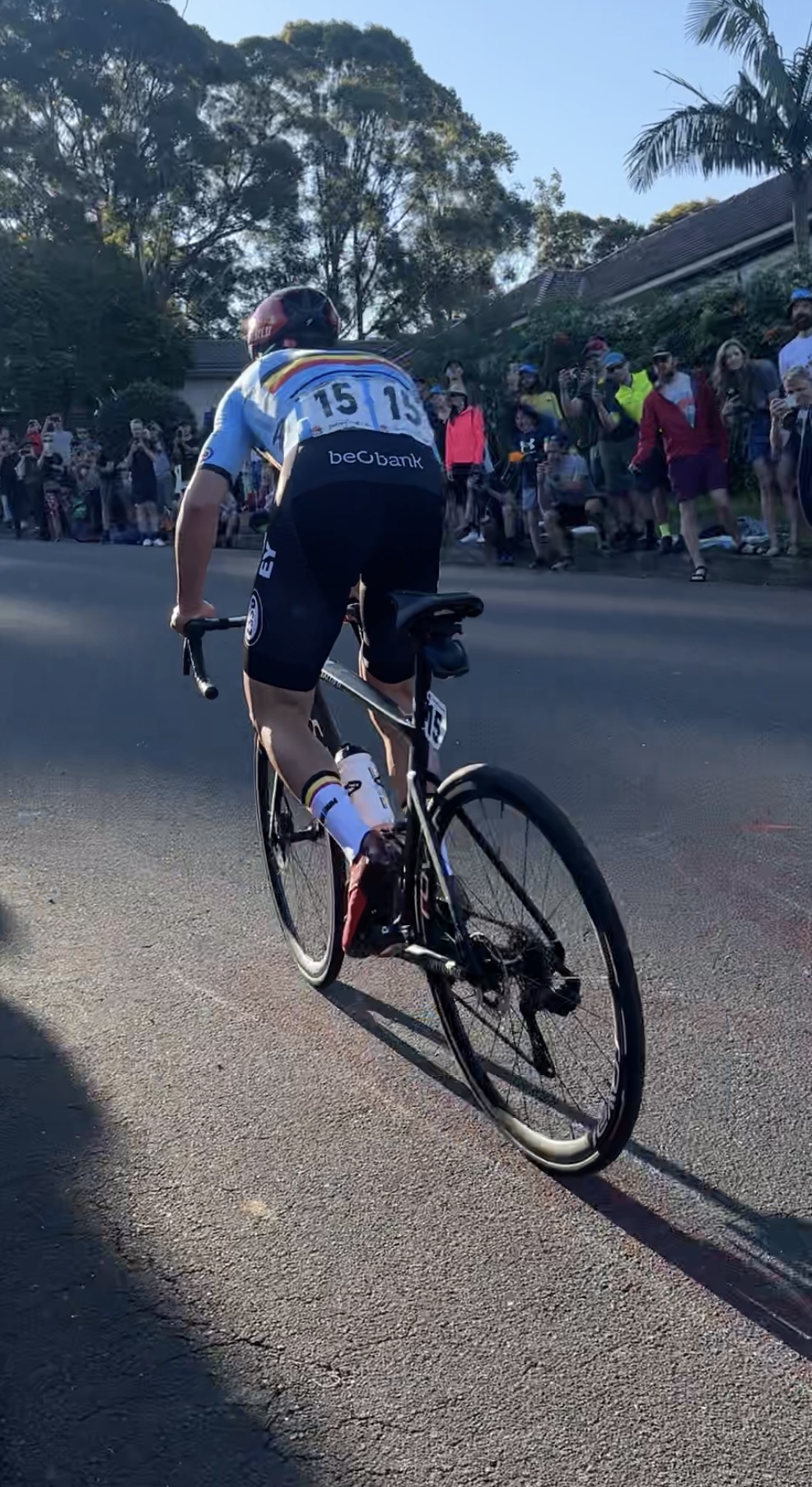 Remco Evenepoel attacking, rear view